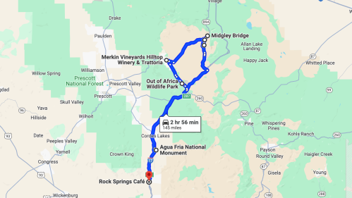 Map showing a route from Rock Springs Café to Midgley Bridge, passing through Agua Fria National Monument and Out of Africa Wildlife Park.